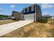 Charming two-story home with a two-car garage and a long driveway at 250 Marinna Joy Cir, Rockwell, NC 28138