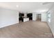 Open floor plan with hardwood floors, a kitchen, and a bright, spacious feel at 250 Marinna Joy Cir, Rockwell, NC 28138