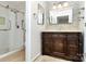 Bathroom featuring a decorative tile wall, glass shower, and vanity at 2506 Breuster Dr, Charlotte, NC 28210