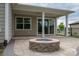 Backyard patio featuring a stone fire pit at 286 Hemlock Bluff Ct, Denver, NC 28037
