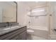 Bathroom features granite countertop, large mirror, and tiled tub-shower combination at 286 Hemlock Bluff Ct, Denver, NC 28037