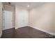Bedroom features hardwood floors, white trim, and a closet with double doors at 286 Hemlock Bluff Ct, Denver, NC 28037