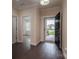 Charming foyer with dark wood floors, an open doorway, and a view into the living area at 286 Hemlock Bluff Ct, Denver, NC 28037