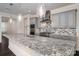 Stylish kitchen featuring an island with granite countertops, stainless steel appliances, and modern lighting at 286 Hemlock Bluff Ct, Denver, NC 28037