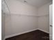 Walk-in closet with white wire shelving and hardwood floors at 286 Hemlock Bluff Ct, Denver, NC 28037