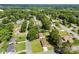 This aerial shows a residential area with mature trees and well-kept yards at 300 Scotland Dr, Kings Mountain, NC 28086