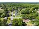 An aerial view displays a neighborhood with many mature trees at 300 Scotland Dr, Kings Mountain, NC 28086