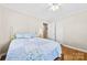 Bedroom with closet and hardwood floors with an ensuite bathroom and natural light at 300 Scotland Dr, Kings Mountain, NC 28086