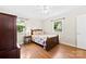 Cozy bedroom with hardwood floors, ceiling fan, and natural light from two windows at 300 Scotland Dr, Kings Mountain, NC 28086