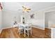 Bright dining room with hardwood floors, white table set, and neutral decor at 300 Scotland Dr, Kings Mountain, NC 28086