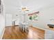 Cozy dining room with hardwood floors, modern lighting, and window at 300 Scotland Dr, Kings Mountain, NC 28086