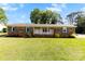 Charming brick ranch-style home with a well-manicured lawn and a welcoming front porch at 300 Scotland Dr, Kings Mountain, NC 28086