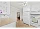 Well-maintained kitchen with white appliances, neutral countertop and access to the living room at 300 Scotland Dr, Kings Mountain, NC 28086