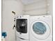 Well-lit laundry area with modern washer and dryer units for efficient laundry care at 300 Scotland Dr, Kings Mountain, NC 28086
