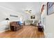 Cozy living room with hardwood floors, a ceiling fan, and plenty of natural light at 300 Scotland Dr, Kings Mountain, NC 28086