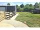 Large backyard with a fenced perimeter, a storage shed and a large steel building at 3100 Wallace Rd, Midland, NC 28107