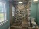 Modern bathroom featuring a walk-in tiled shower and bench at 3100 Wallace Rd, Midland, NC 28107