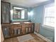 Bathroom featuring double vanity with a rustic wood finish at 3100 Wallace Rd, Midland, NC 28107