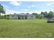 Charming ranch style home with a well manicured lawn and covered front porch at 3100 Wallace Rd, Midland, NC 28107