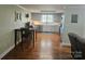 Bright kitchen with stainless steel appliances, gray cabinets, and hardwood floors at 3100 Wallace Rd, Midland, NC 28107