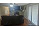 Cozy living room featuring stone fireplace, hardwood floors and access to a patio at 3100 Wallace Rd, Midland, NC 28107