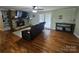 Comfortable living room features a stone fireplace, hardwood floors, and natural light at 3100 Wallace Rd, Midland, NC 28107