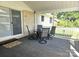 Covered patio with outdoor seating, perfect for enjoying the outdoors at 3100 Wallace Rd, Midland, NC 28107