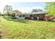 Spacious backyard with a well-maintained lawn, mature trees, and a view of the home's rear exterior at 3119 6Th Sw Ave, Hickory, NC 28602