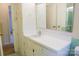 Well-lit bathroom featuring a vanity with a sink and ample storage at 3119 6Th Sw Ave, Hickory, NC 28602