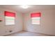 Well-lit bedroom featuring two windows and simple, comfortable decor at 3119 6Th Sw Ave, Hickory, NC 28602