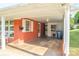 A spacious carport area with brick walls, a window, and an exterior door at 3119 6Th Sw Ave, Hickory, NC 28602