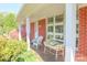 Inviting covered porch with comfortable seating, perfect for relaxing outdoors at 3119 6Th Sw Ave, Hickory, NC 28602