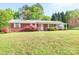 Charming brick home featuring a well-maintained lawn and colorful landscaping at 3119 6Th Sw Ave, Hickory, NC 28602