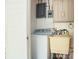 Functional laundry area with a washer, utility sink, and storage cabinets at 3119 6Th Sw Ave, Hickory, NC 28602