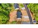 An aerial view showcases a home with a dark roof, nice yard and adjacent to the street at 3315 15Th Sw Ave, Hickory, NC 28602