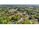 An aerial view of a home nestled among trees and adjacent to a street in a residential neighborhood at 3315 15Th Sw Ave, Hickory, NC 28602