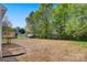 View of large, empty backyard featuring a treeline, and ample space for activities and relaxation at 3315 15Th Sw Ave, Hickory, NC 28602