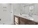 Bright bathroom featuring double sinks, walk-in shower, and tile surround at 3315 15Th Sw Ave, Hickory, NC 28602