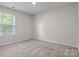 Bright bedroom featuring a window and neutral carpet at 3315 15Th Sw Ave, Hickory, NC 28602