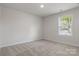 Bright bedroom featuring a window and neutral carpet at 3315 15Th Sw Ave, Hickory, NC 28602