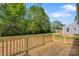 Back deck view of large, empty backyard featuring a treeline, and ample space for activities at 3315 15Th Sw Ave, Hickory, NC 28602