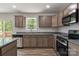 Well appointed kitchen with stainless appliances, stone countertops, and wood cabinets at 3315 15Th Sw Ave, Hickory, NC 28602
