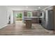 Modern kitchen features stainless steel appliances, gray cabinets, granite counters, and access to the deck at 3315 15Th Sw Ave, Hickory, NC 28602