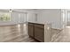 Bright living room featuring wood flooring, a ceiling fan, and an open floor plan at 3315 15Th Sw Ave, Hickory, NC 28602