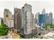 Stunning aerial view capturing the city skyline with multiple high-rise buildings and lush greenery at 333 W Trade St # 800, Charlotte, NC 28202