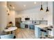 This kitchen has modern, two-tone cabinetry, stainless appliances, and an adjacent breakfast nook at 333 W Trade St # 800, Charlotte, NC 28202