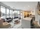 Bright living room features large windows, sofas, and an open kitchen, perfect for entertaining at 333 W Trade St # 800, Charlotte, NC 28202