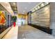 Modern lobby featuring unique design elements, marble floors, stainless steel elevators, and plants at 333 W Trade St # 800, Charlotte, NC 28202
