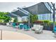 Outdoor lounge area with plush seating, privacy landscaping, and sun shade at 333 W Trade St # 800, Charlotte, NC 28202