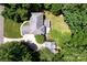 Aerial view of a home with lush green surroundings and a large driveway at 3546 Weddington Oaks Dr, Weddington, NC 28104